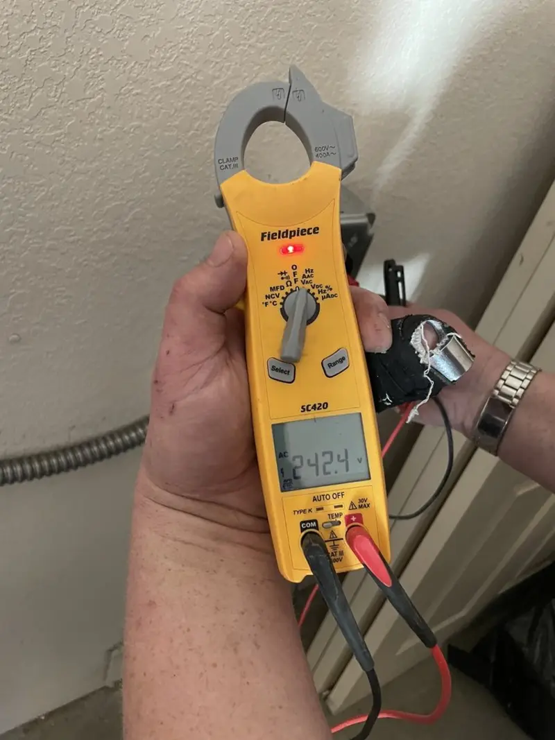 Voltage testing with clamp meter during Circuit Breaker Repair in Highland Heights